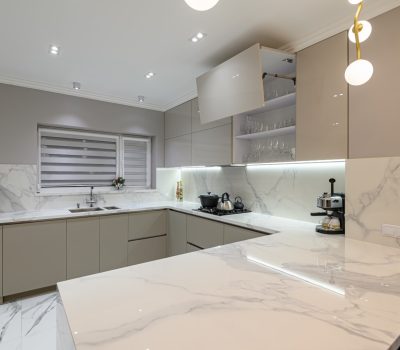 Luxury large modern white marble kitchen united with dining room